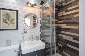 The striking en suite shower-room for Bedroom 2, with rainfall shower head.