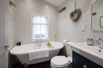 The family bathroom has a double-ended claw-foot bath, perfect for a relaxing soak.