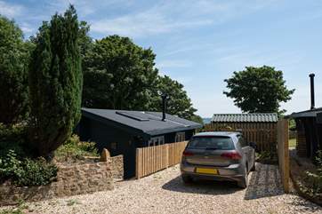 The view when you arrive, with private parking, 6 steep steps lead down to the lodge.