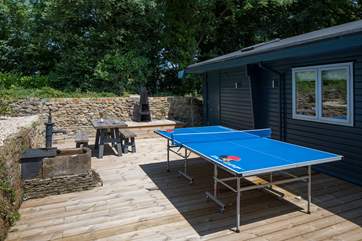 The rear courtyard is a sheltered sun-trap, ideal for a little competition on holiday.