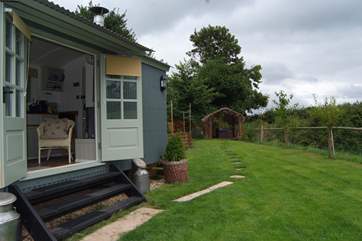 From the steps of the hut you have countryside views, with the hot tub down at the far end of the garden in a sheltered position.