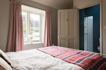 The double bedroom has a fabulous en-suite shower room.