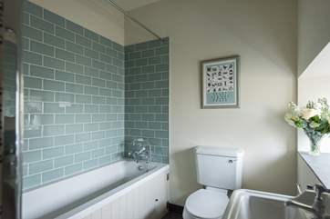The bathroom is at the end of the barn.