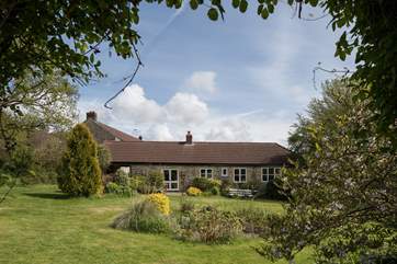 The cottage faces the fabulous garden, the owner's house is to the left