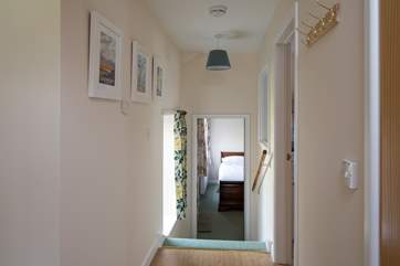 Four steep steps lead down to bedroom 2, the utility-room is to the right of the photograph.