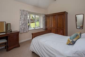Bedroom 1 has views over the beautiful garden.