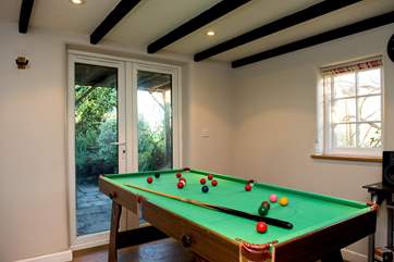 Have some holiday fun playing pool.