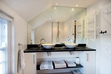 The en suite wet-room for bedroom 1 with double wash-basin.