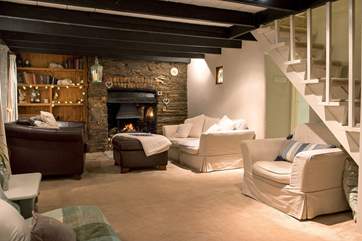 The sitting-room has plenty of room to spread out and is full of character.