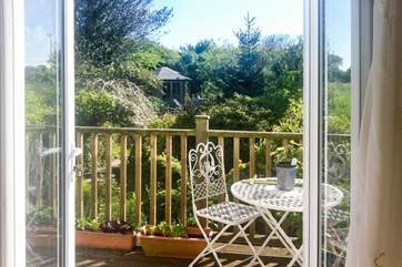 From bedrooms 1 and 3 you can step out onto the balcony and look out over the garden - a lovely spot any time of the day.