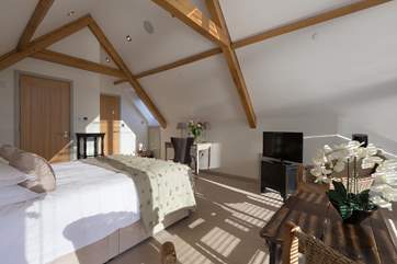 Another view of the master bedroom which has the feel of a private suite.