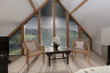 What a room to start off the day in. The views are over the garden below and the hillside beyond.
