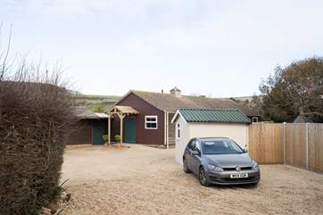 Just steps away from The Stables is the outside utility-room with washing machine and tumble-drier.
