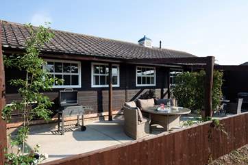 A charming outdoor seating area with views over Brighstone Downs