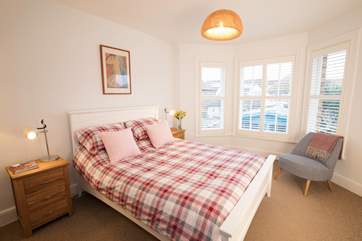 Cosy up in the king-size bed in the master bedroom for a good night's sleep.
