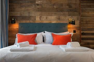 Crisp white linens with fluffy towels on your bed.