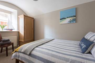 Bedroom 2 has an original vaulted ceiling.