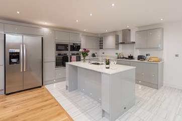 The first floor has a spacious and very contemporary kitchen with the island as the sociable focal point for the family to gather around.