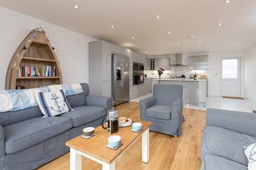 Waterhayes is a stunning new detached house over three floors with two relaxed seating areas - one with a balcony to the front - and a huge deck to the rear.