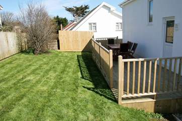 There is a large decking-area and garden at the back of the property that catches the evening sun - so a great place for an evening drink.