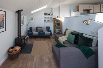 The living-area has a fabulous wood-burner, which sets the perfect scene for cuddling up and enjoying a cosy night in.