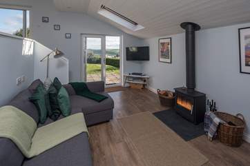 The living-room opens out onto the paved patio area. This fantastic layout allows everyone to enjoy this lovely property and fabulous location to the full.