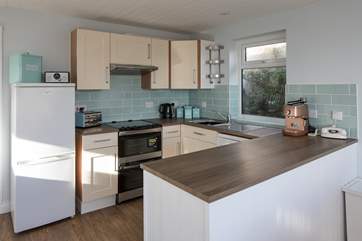 The well-equipped kitchen offers plenty of space to whip up a feast.
