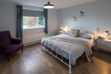 The master bedroom is very spacious and tastefully presented.