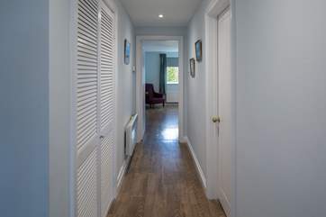 The hallway connects the house wonderfully, this view is leading off down to the master bedroom from the kitchen.