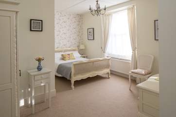 Bedroom 2 is very pretty. With oodles of space and a TV, this is a lovely bedroom to retire to.