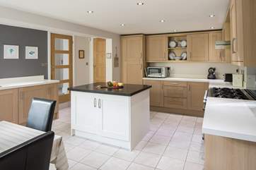 The kitchen is a wonderful space to gather for a drink or create a feast fit for a king.