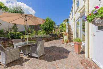 Fabulous enclosed patio-area. Perfect for dining al fresco in the sun.