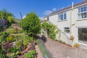 If you fancy breaking away for some real peace and quiet, why not slip away up the steps along the side of the house to the raised patio area - and don’t forget a good book!