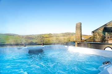 Come to Tregada Barn and relax in the hot tub.