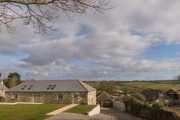 A view of the barns across the farm towards the rolling hills beyond.
