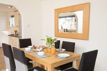 Feel the sun on your faces as the sun comes through the window while you eat your breakfast around the dining-table, seating six.