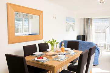 The open plan living/dining area is a great space to watch the children play inside or out in the enclosed patio area.