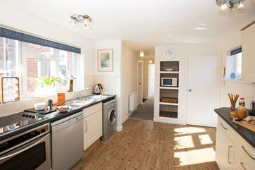 The large kitchen area is fully equipped and has plenty of space for your creative cooking