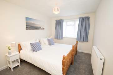 The apartment has three lovely bedrooms, including this delightful twin bedroom.