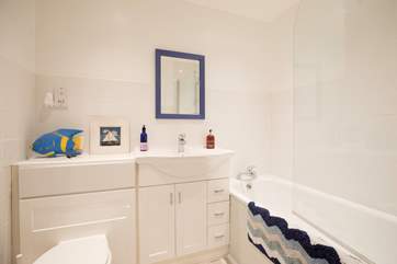The family bathroom with bath for a relaxing hot bubble bath.