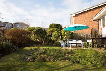 Take a drink outside and enjoy the Island's sunshine all year around. There are also outdoor sofas at the bottom of the garden!