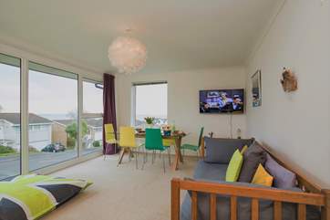 The fabulous sitting-room with dining-area has uninterrupted views of the sea, so sit back and enjoy.