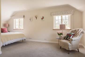 The master bedroom is flooded with natural light.