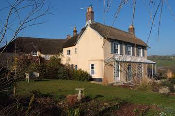 The attached cottage is to the left of the main house, you can book the house for up to 10 guests or both the house and cottage for up to 14 guests.