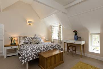This is the double bedroom in the cottage part of Champarty. It is a wonderfully 'Scandinavian' feeling room with high ceilings and a bright style.