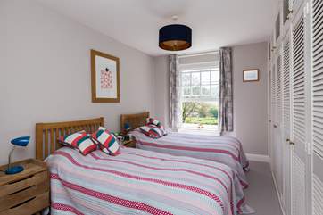 The twin bedroom faces out to the front of this gorgeous house.