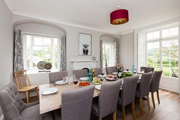 The dining room has views across the gardens and the countryside beyond