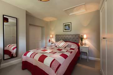 The door to the left leads to the family bathroom, the bunk bedroom and beyond the bathroom there is a door to the cottage.