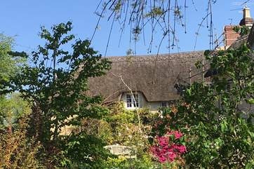 This is the attached cottage - reserved solely for groups of 14 and never booked separately. It has its own courtyard garden and links to the main house on the first floor.