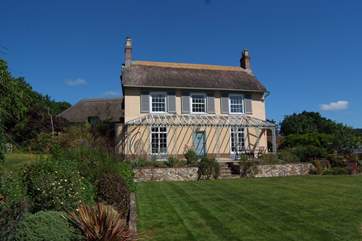 The main house accommodates 10, and the attached linked cottage, to the left of the photo, sleeps 4. The two link together on the first floor for excellent flexibility if you wish.